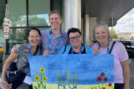 From left: Kimberly Creem, Campe Goodman, Karina from the JDC and Jennifer Weinstock with art painted by children at the JDC “hotel” in Poland for Ukrainian refugees (Photo: CJP)