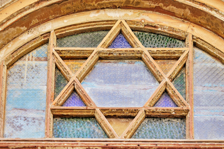 Stained glass window with magen david in an old restored house.