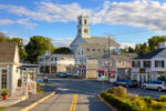 Chatham, MA, USA - September 15, 2014: Small Town Street, Chatham, Cape Cod, Massachusetts. The image shows a fragment of the Main street as seen from the Seaview street, with the First United Methodist Church in background. Canon EF 24-105mm f4L IS lens. This HDR photorealistic image is lit by the evening sun.