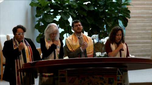 Temple Israel clergy leading a High Holy Day service from the Bima