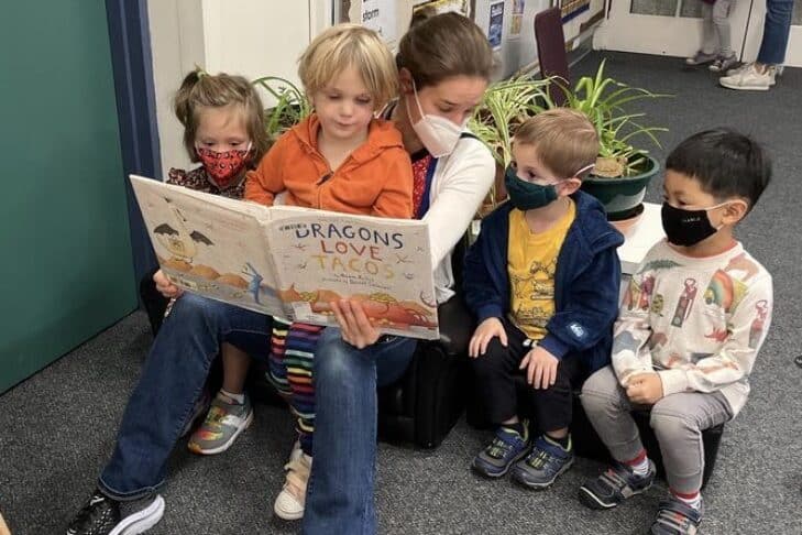 Teacher Reading + Children