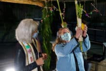 Shakingn the lulav and etrog in the Temple Israel Sukkah