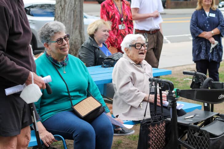 2Life Communities resident Rochelle Weil and Hebrew SeniorLife resident Anne Umansky celebrating their mobility at the Brookline Historical Association Lawn
