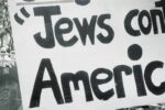GettyImages-539612488_Antisemitic Conspiracy Sign