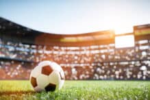 Soccer Ball Stadium Football soccer ball on grass field on stadium. Sport