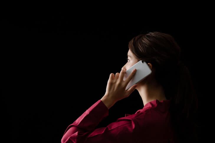 Asian girl calling with a smart phone.