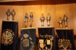 A photo showing four covered Torah scrolls inside a wooden ark