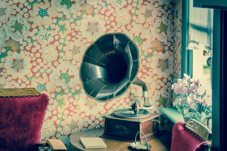 Gramophone Record Player Music Image of photograph with elaborate flowery wallpaper design in background