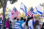 Los Angeles, California, USA- November 18, 2012: Los Angeles rally in support of Isreal. Man and women are holding Israel and USA flags.