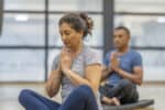 Man and woman in yoga class, health, well-being, fitness, exercise, self-care