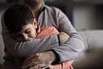 Parent father comforting young son boy children kid (Photo: ridvan_celik/iStock)