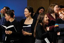 cropped Young adults chatting at a High Holy Day service