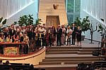 Screenshots from Rosh Hashanah services Large group of congregants on the bima for Torah reading