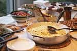 Potluck Lunch Dinner Table Linda Raymond iStock