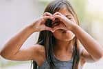 Young girl kid child making heart gesture with hands Little_Hands_Big_Hearts_FY26-