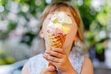 Preschool toddler little girl children kid ice cream Little preschool girl eating ice cream in waffle cone on sunny summer day. Happy toddler child eat icecream dessert. Sweet food on hot warm summertime days. Bright light, colorful ice-cream.