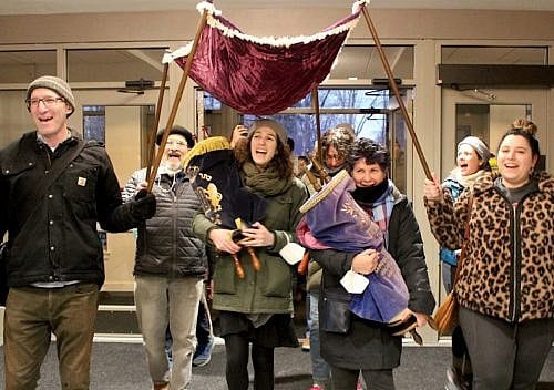 Hebrew College faculty and students accompany the Torah scrolls to their new collaborative campus home on Washington Street in Newton (Courtesy photo)